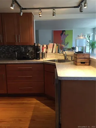a kitchen with a sink and cabinets