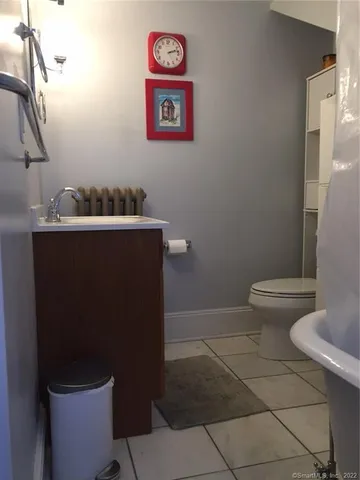 a bathroom with a toilet and a sink