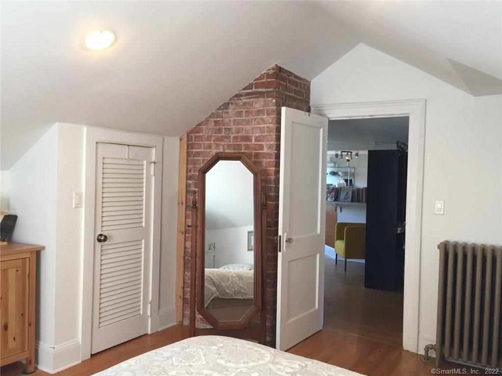 209 Willard Street, Unit 3 New Haven, CT 06515 - Photo 21 of 29 a bedroom with a bed and a mirror