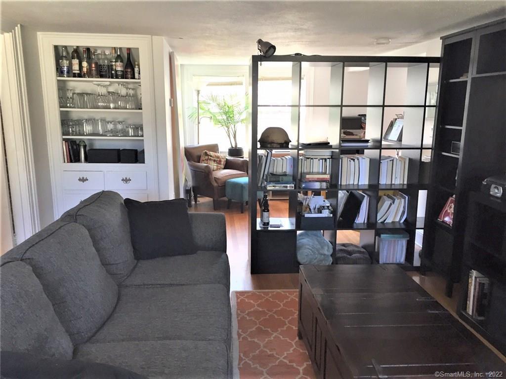 209 Willard Street, Unit 3 New Haven, CT 06515 - Photo 4 of 29 a living room with furniture large window and wooden floor