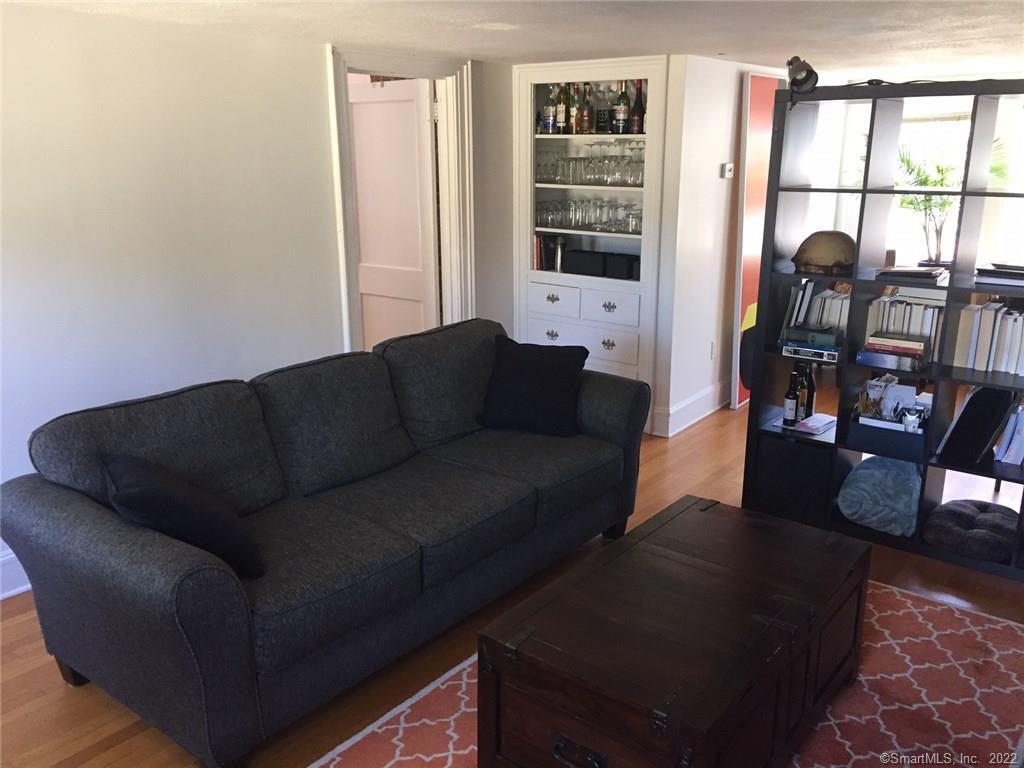 209 Willard Street, Unit 3 New Haven, CT 06515 - Photo 5 of 29 a living room with furniture and a floor to ceiling window