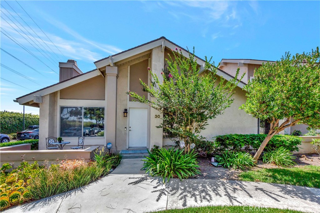 30 Silverwood Irvine, CA 92604 - Photo 1 of 32 a front view of a house with garden