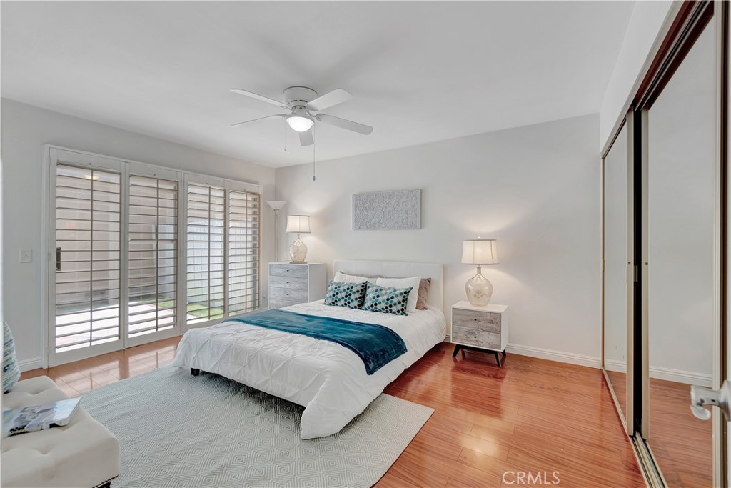 30 Silverwood Irvine, CA 92604 - Photo 16 of 32 a spacious bedroom with a bed and a large window