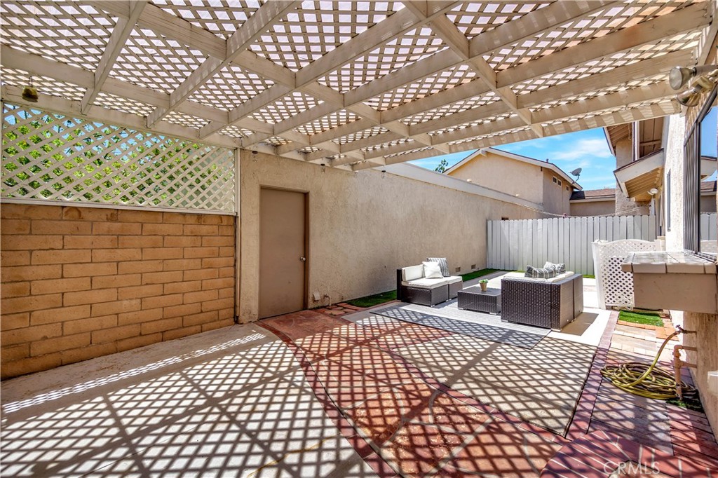 30 Silverwood Irvine, CA 92604 - Photo 24 of 32 a view of a patio with a table and chairs