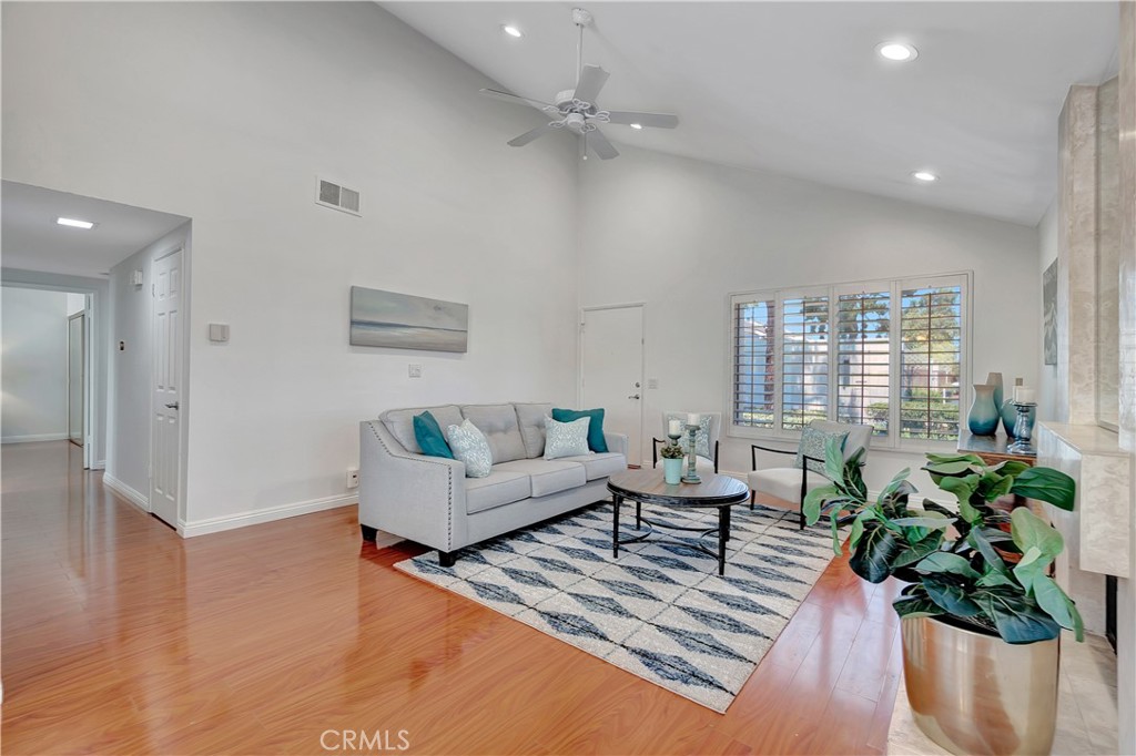 30 Silverwood Irvine, CA 92604 - Photo 5 of 32 a living room with furniture and a potted plant