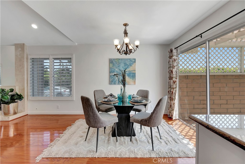 30 Silverwood Irvine, CA 92604 - Photo 7 of 32 a view of a dining room with furniture window and wooden floor