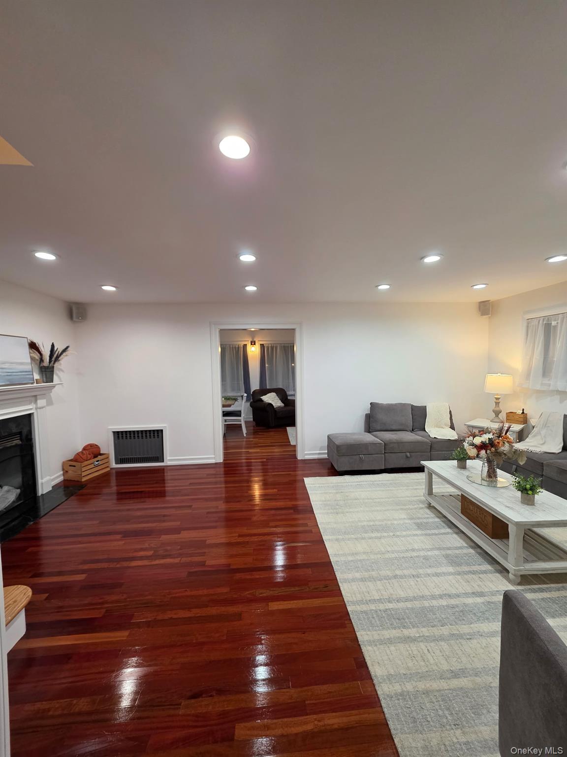 12-14 West 5th Road Queens, NY 11693 - Photo 31 of 43 a living room with furniture and a wooden floor