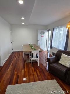 12-14 West 5th Road Queens, NY 11693 - Photo 33 of 43 a living room with furniture and a wooden floor