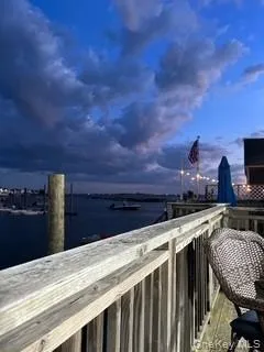 a view of a yard with wooden fence