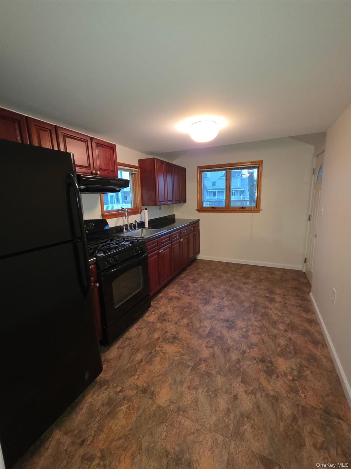 12-14 West 5th Road Queens, NY 11693 - Photo 5 of 43 a kitchen with stainless steel appliances granite countertop a refrigerator and a stove top oven