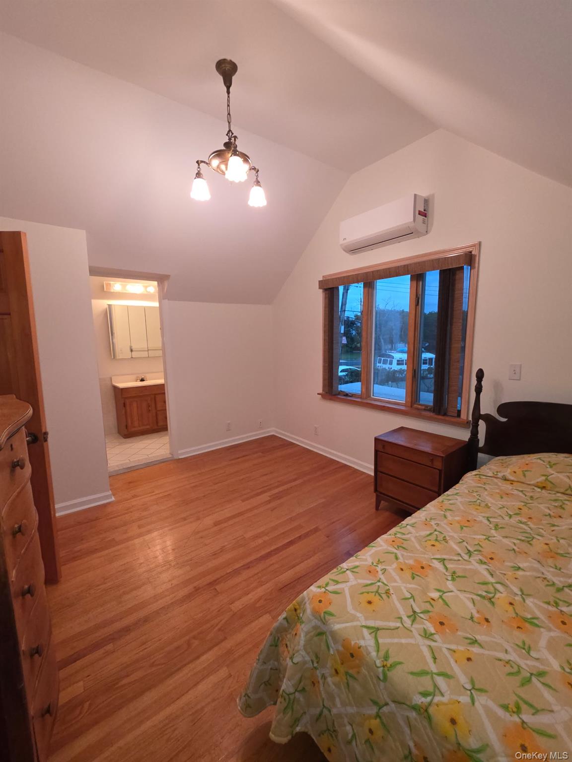 12-14 West 5th Road Queens, NY 11693 - Photo 9 of 43 a bedroom with a bed and a large mirror