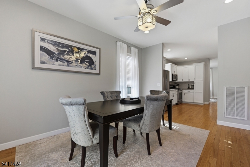 68 Arch Street Butler, NJ 07405 - Photo 11 of 46 a view of a dining room with furniture window and wooden floor