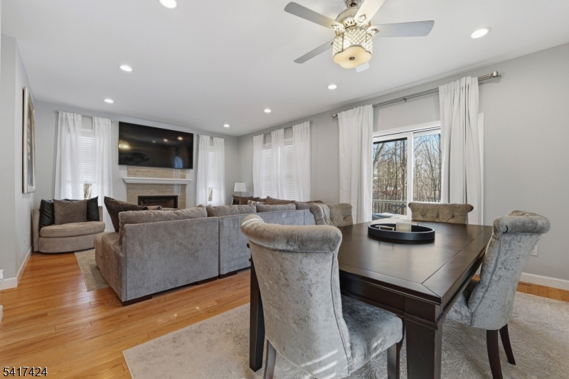 68 Arch Street Butler, NJ 07405 - Photo 12 of 46 a living room with furniture a flat screen tv and a window