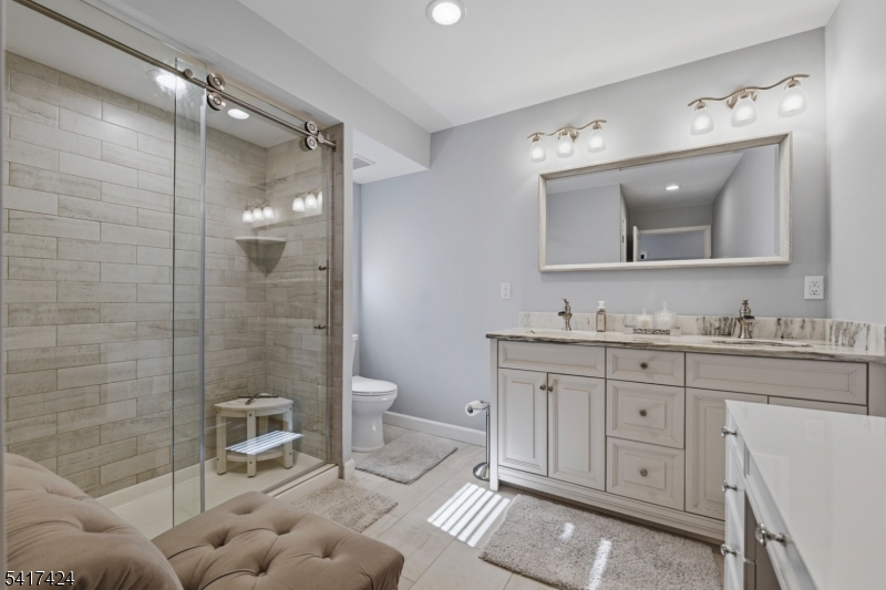 68 Arch Street Butler, NJ 07405 - Photo 25 of 46 a bathroom with a granite countertop sink mirror and toilet