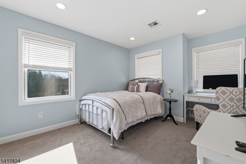 68 Arch Street Butler, NJ 07405 - Photo 28 of 46 a bedroom with a bed and a window