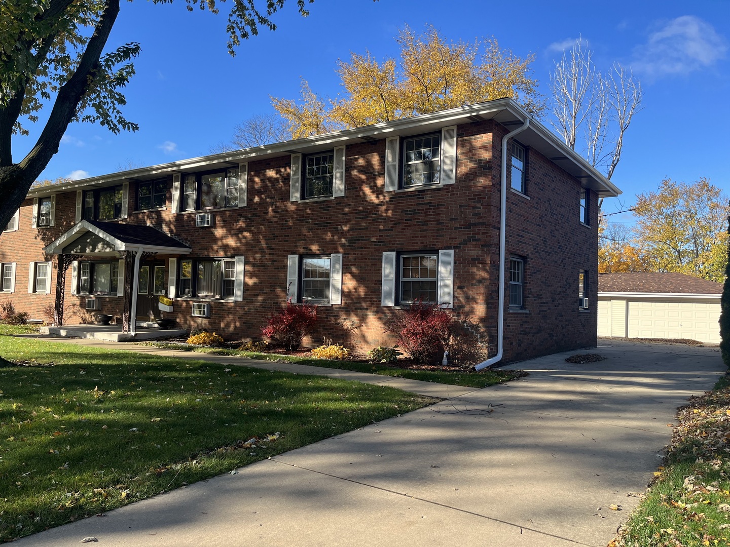 517 Bethel Drive, Unit 2S Joliet, IL 60435 - Photo 2 of 18 a front view of a house with a yard table and chairs