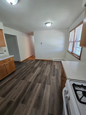 wooden floor in a hall with an entryway