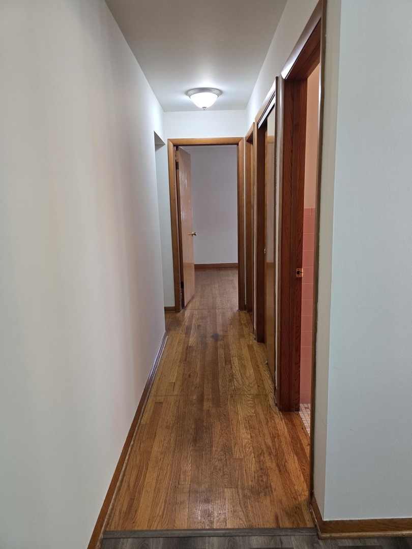 517 Bethel Drive, Unit 2S Joliet, IL 60435 - Photo 8 of 18 a view of a hallway with wooden floor