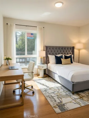 a bedroom with a large bed and a couch