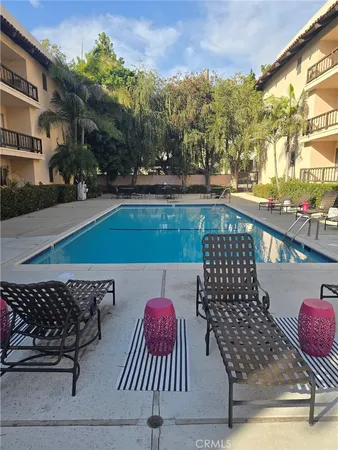 a view of city from balcony with furniture