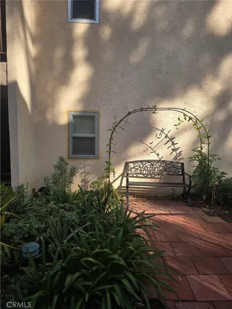 a view of a pathway both side of house