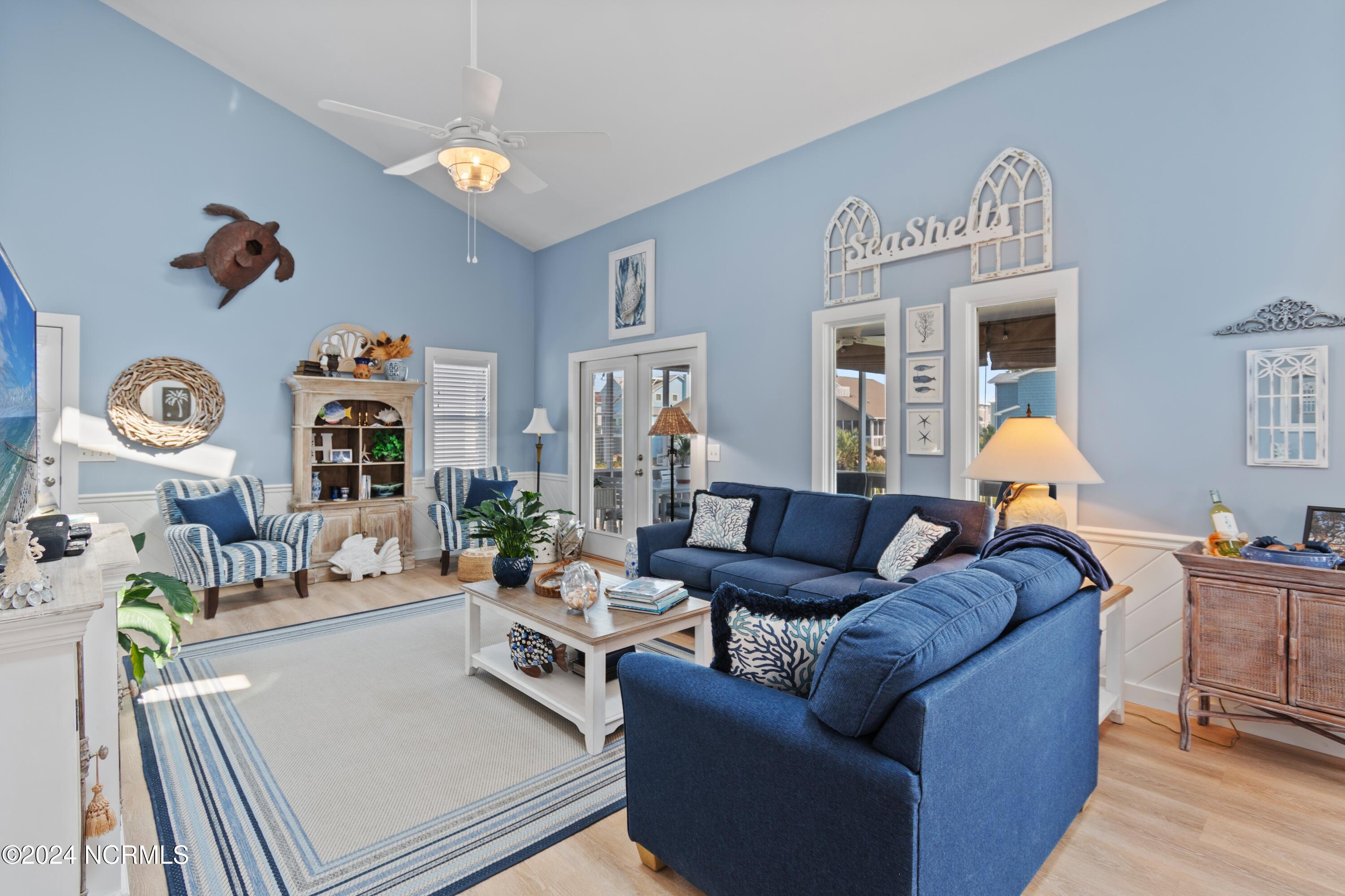 415 Sailfish Street Sunset Beach, NC 28468 - Photo 11 of 63 Open and airy living room with high ceilings.