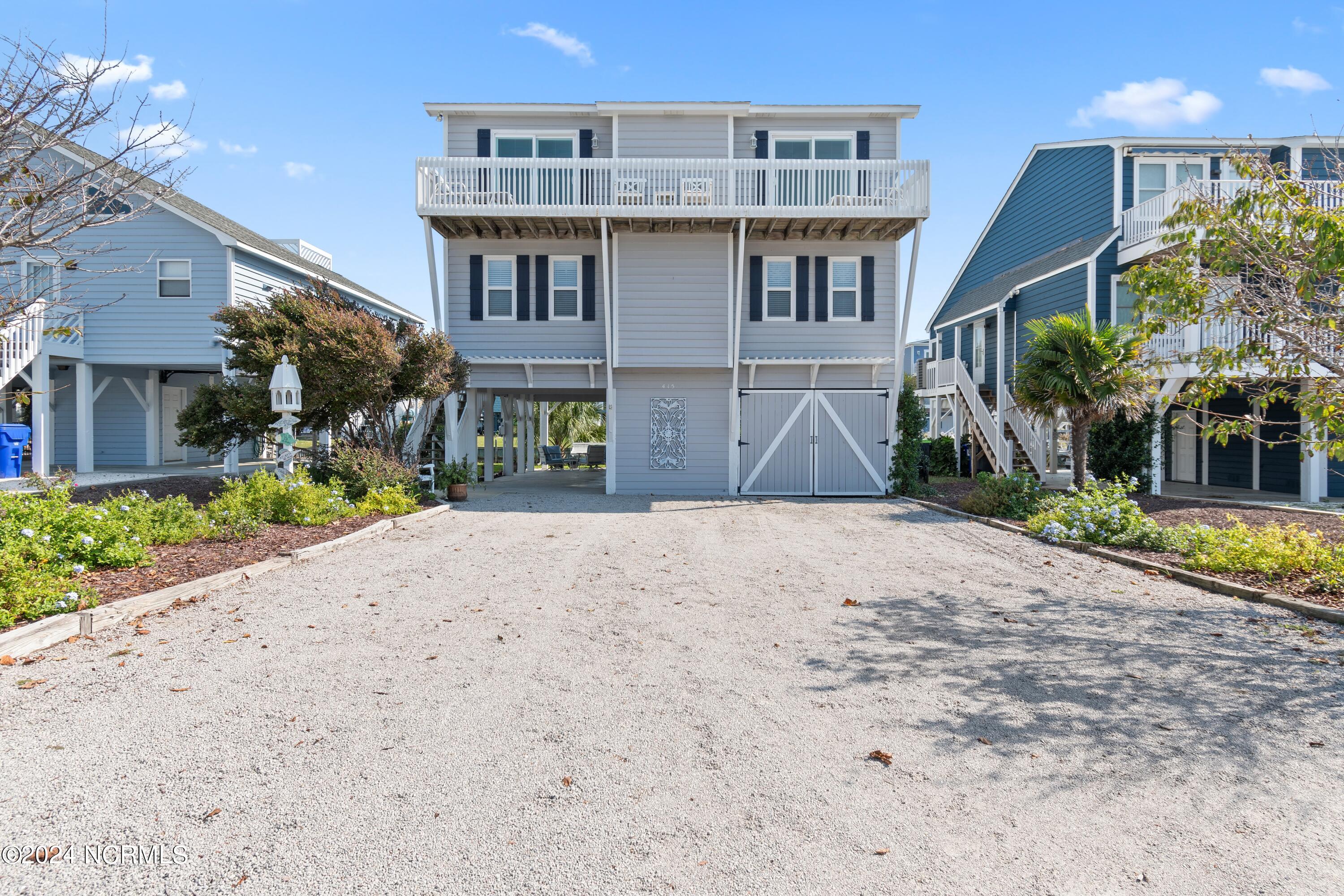 415 Sailfish Street Sunset Beach, NC 28468 - Photo 3 of 63 Enjoy a home where family traditions are built for decades to come.
