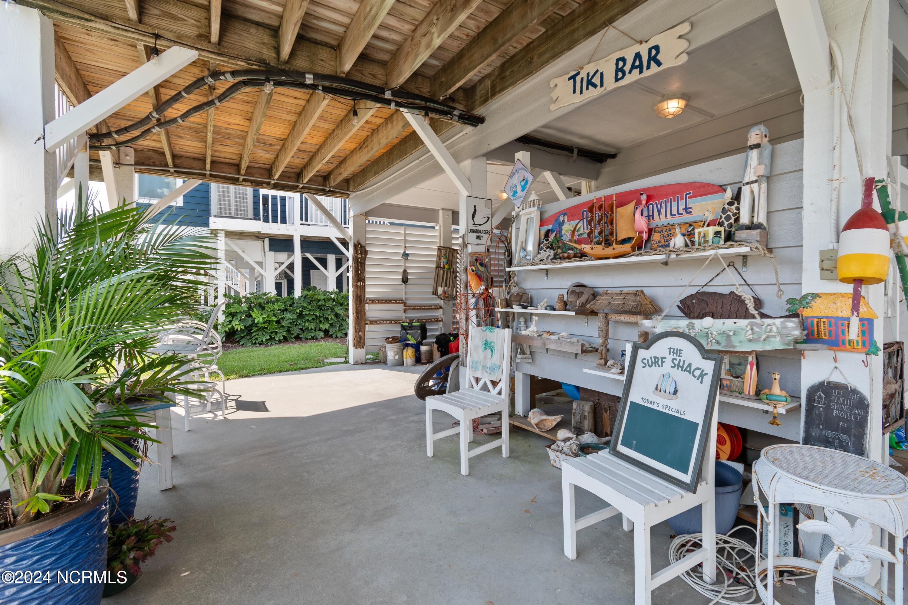 415 Sailfish Street Sunset Beach, NC 28468 - Photo 37 of 63 Under home seating area.