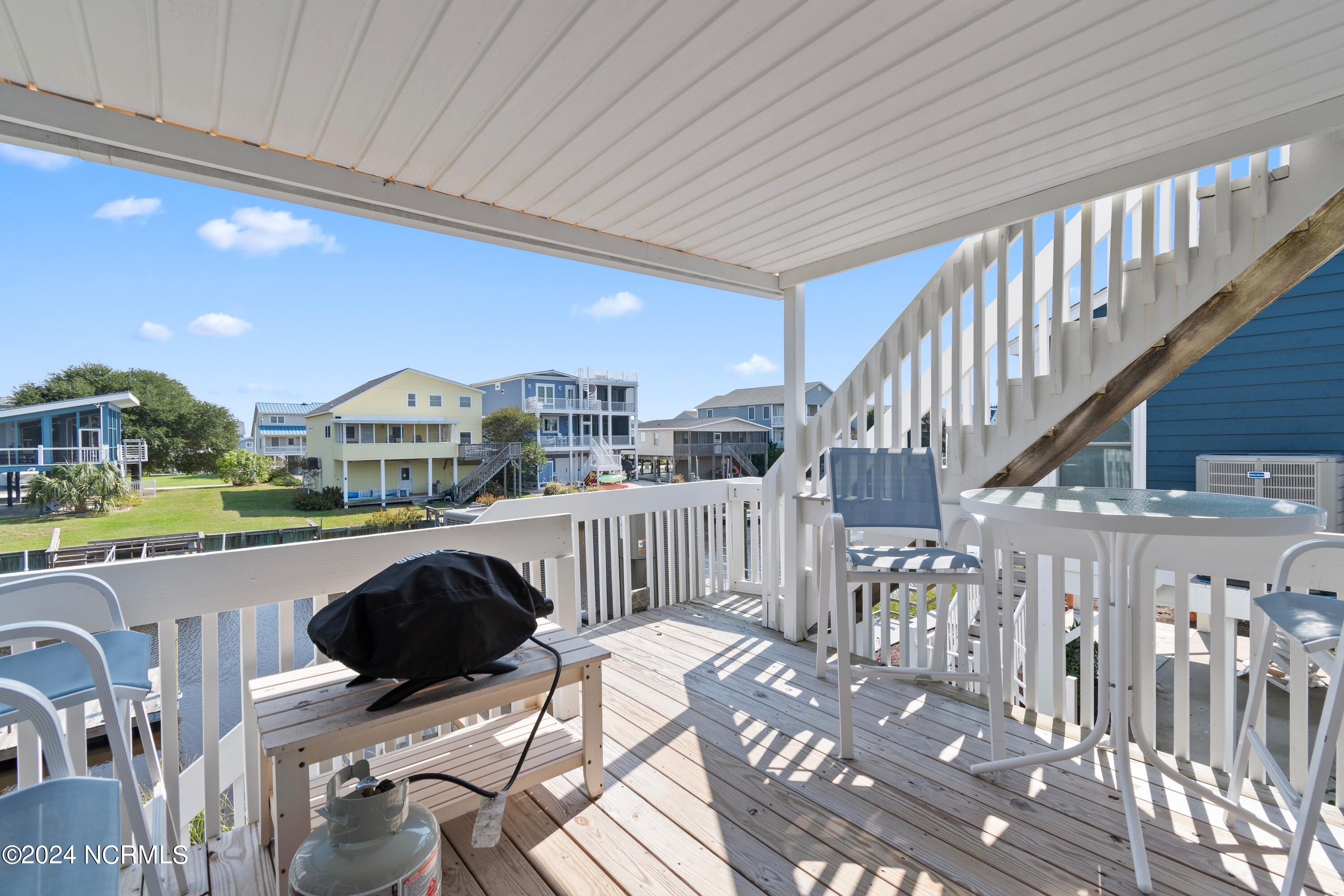 415 Sailfish Street Sunset Beach, NC 28468 - Photo 39 of 63 Bottom deck with water views.