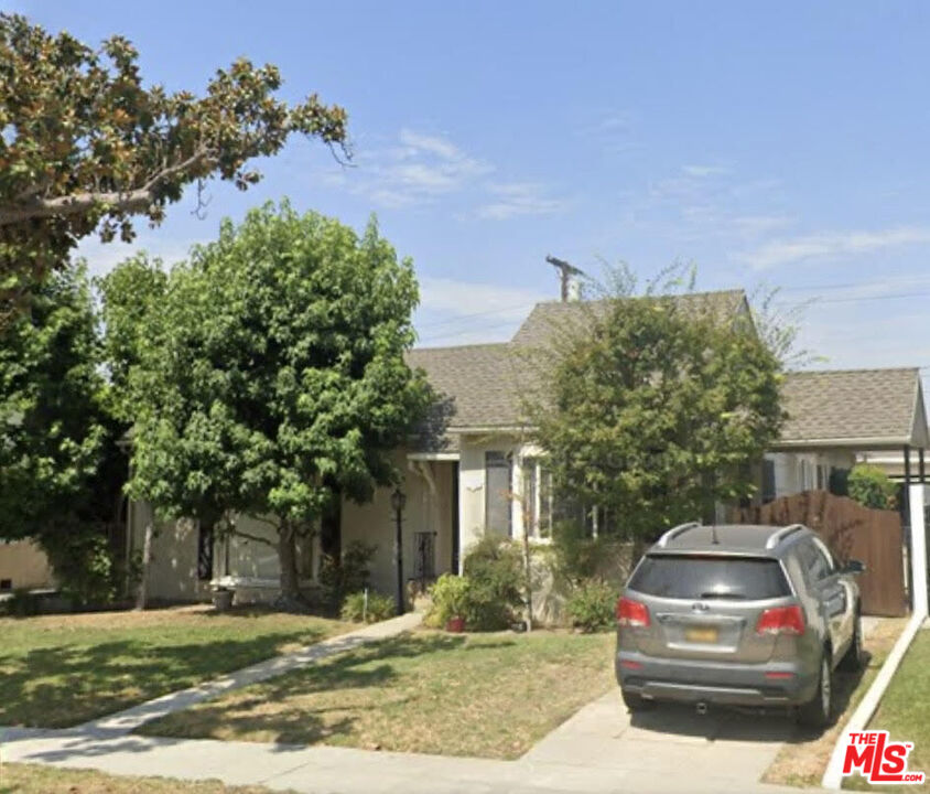 a car parked in front of a house