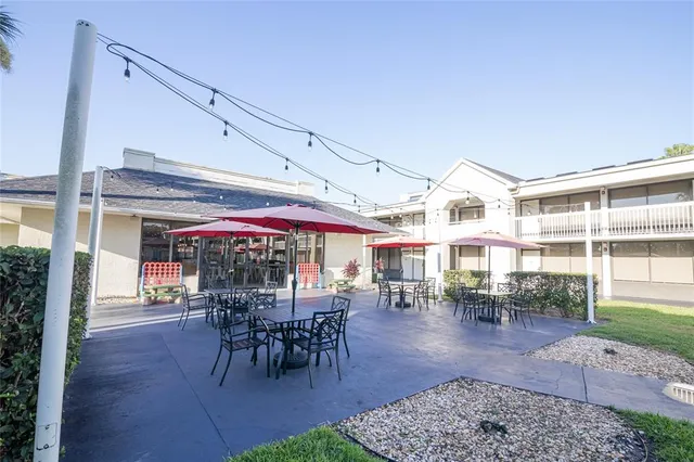 a view of a dining area with lots of table and chairs