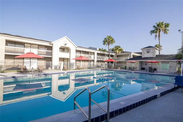 a kitchen with kitchen island granite countertop lots of counter top space and living room