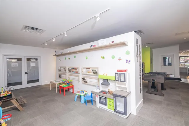 a kitchen with a table and chairs in it
