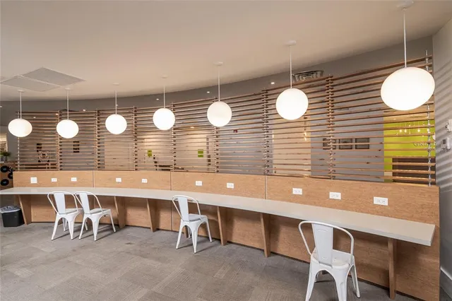 a front view of residential houses with yard and road