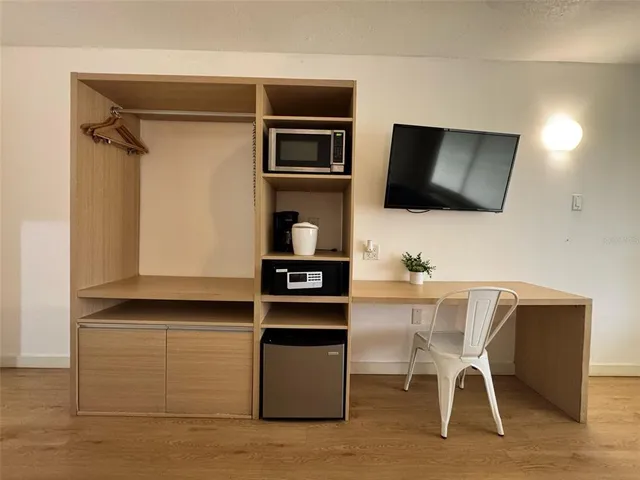 a view of a workspace with furniture