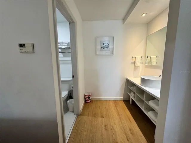 a bathroom with a sink and a mirror