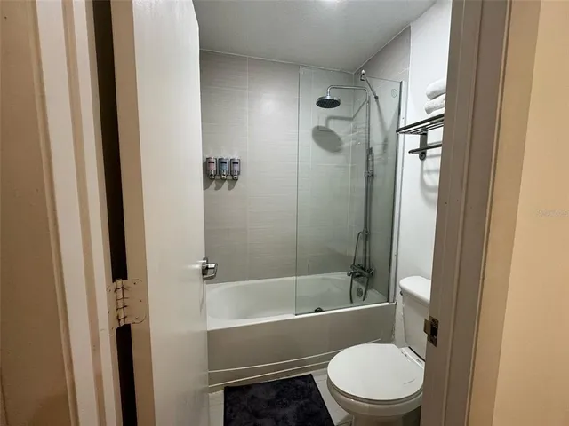 a bathroom with a toilet and a bathtub