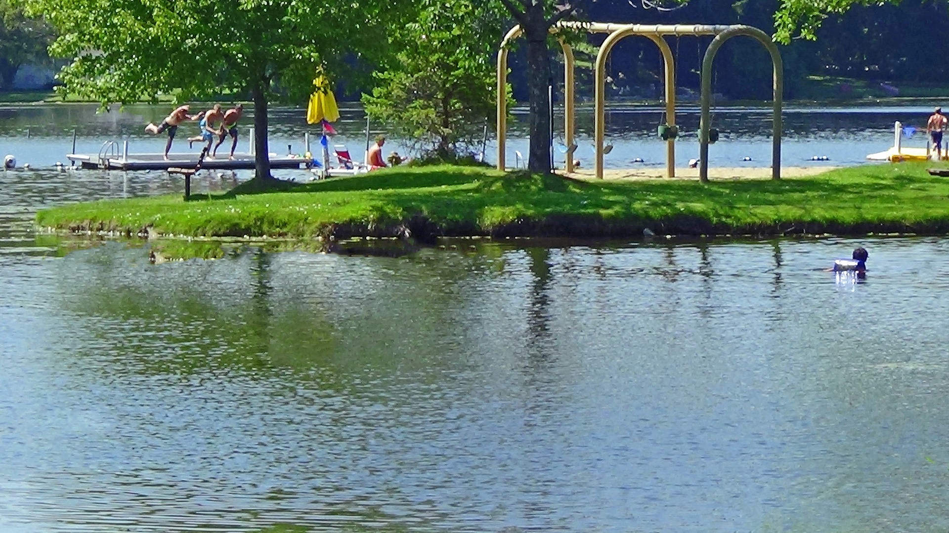 412 Warwick Road Tower Lakes, IL 60010 - Photo 25 of 30 a view of a lake with a house in the background