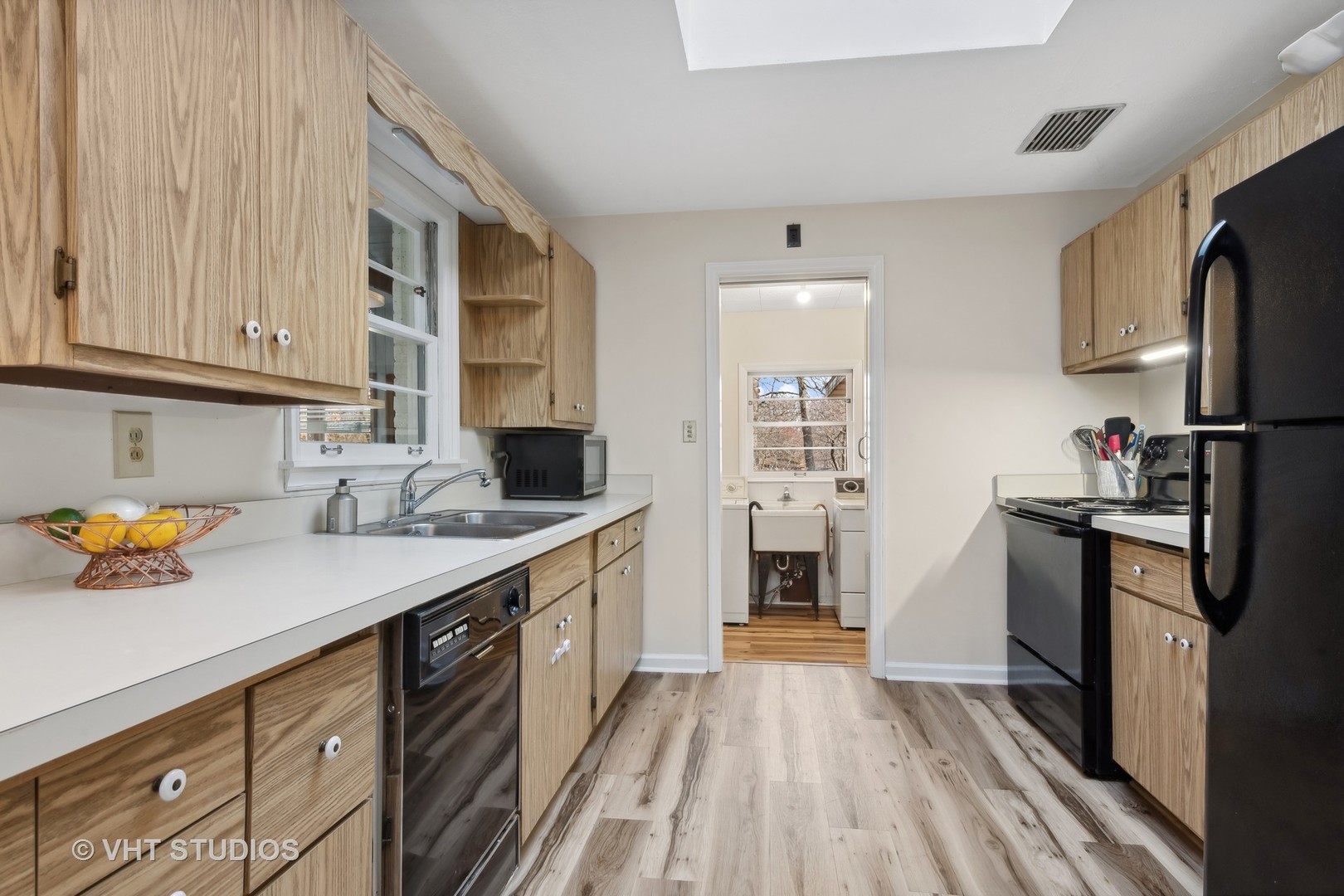 412 Warwick Road Tower Lakes, IL 60010 - Photo 7 of 30 a kitchen with stainless steel appliances a refrigerator sink and cabinets