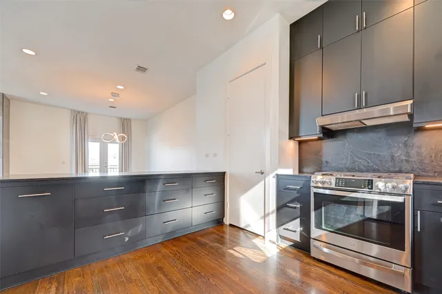 a bathroom with a sink a mirror and shower