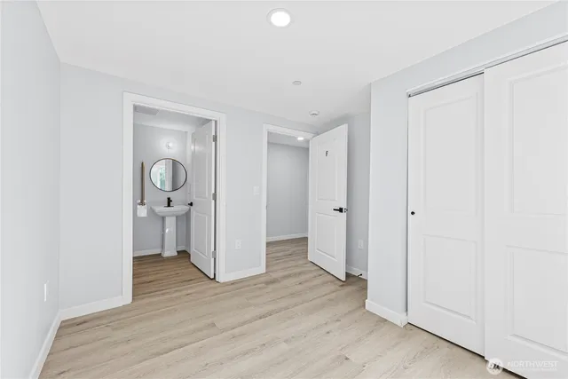 a view of hallway with wooden floor