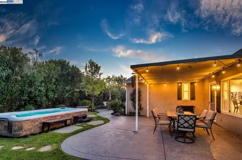 a patio with table and chairs