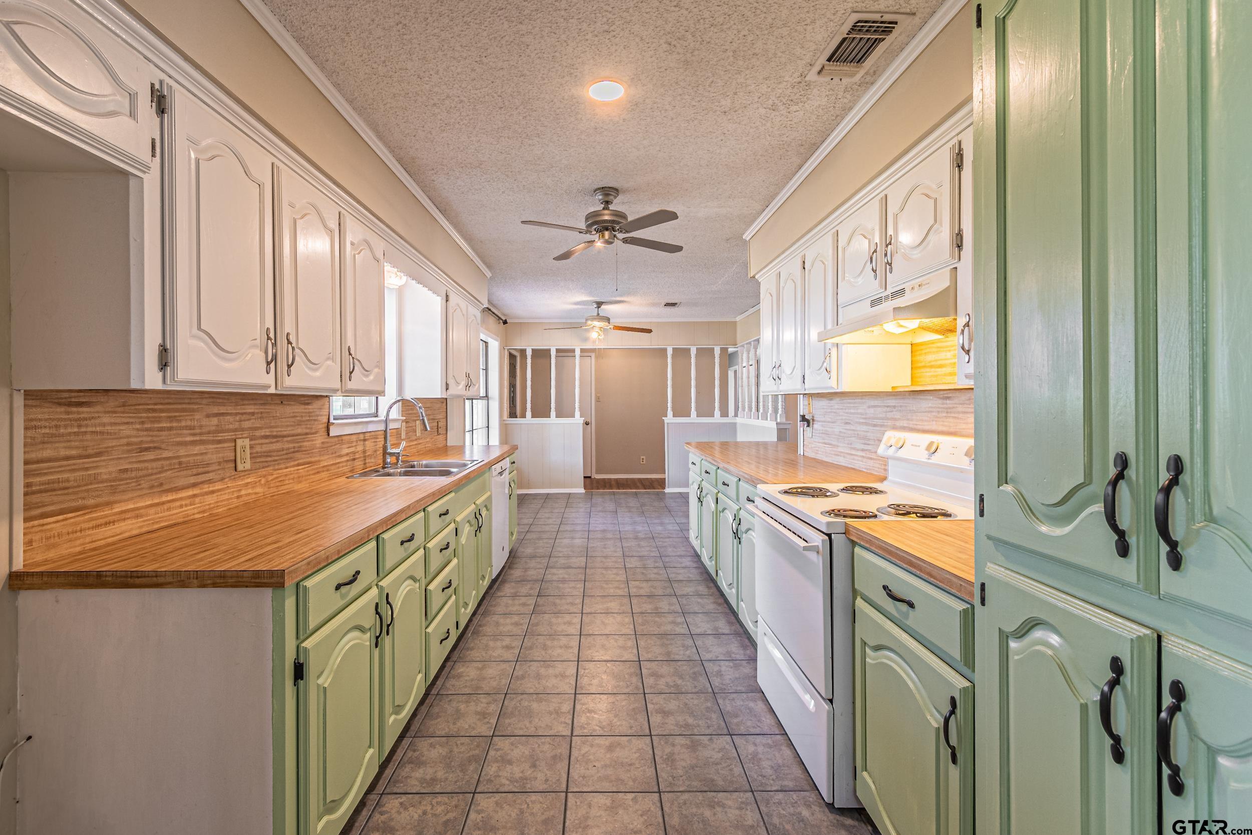 401 VZ County Road Canton, TX 75103 - Photo 14 of 45 a large kitchen with stainless steel appliances granite countertop a large counter top a stove and a refrigerator