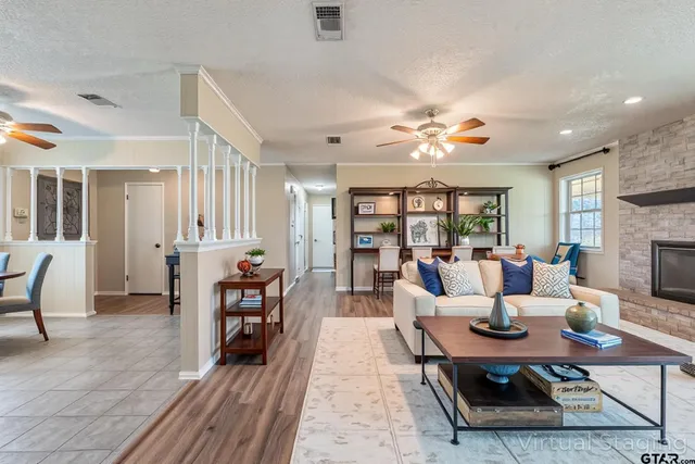 a living room with furniture and a fireplace