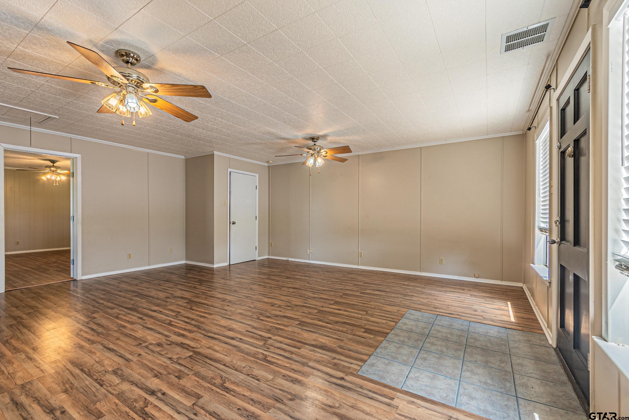 401 VZ County Road Canton, TX 75103 - Photo 26 of 45 wooden floor in an empty room with a window