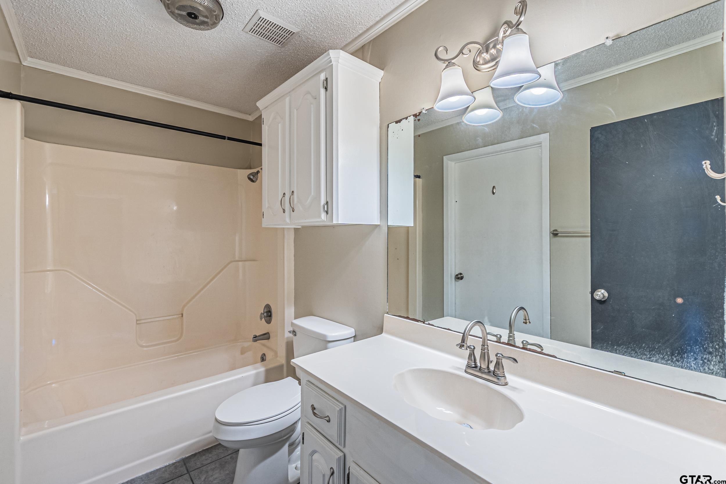 401 VZ County Road Canton, TX 75103 - Photo 28 of 45 a bathroom with a double vanity sink mirror and toilet