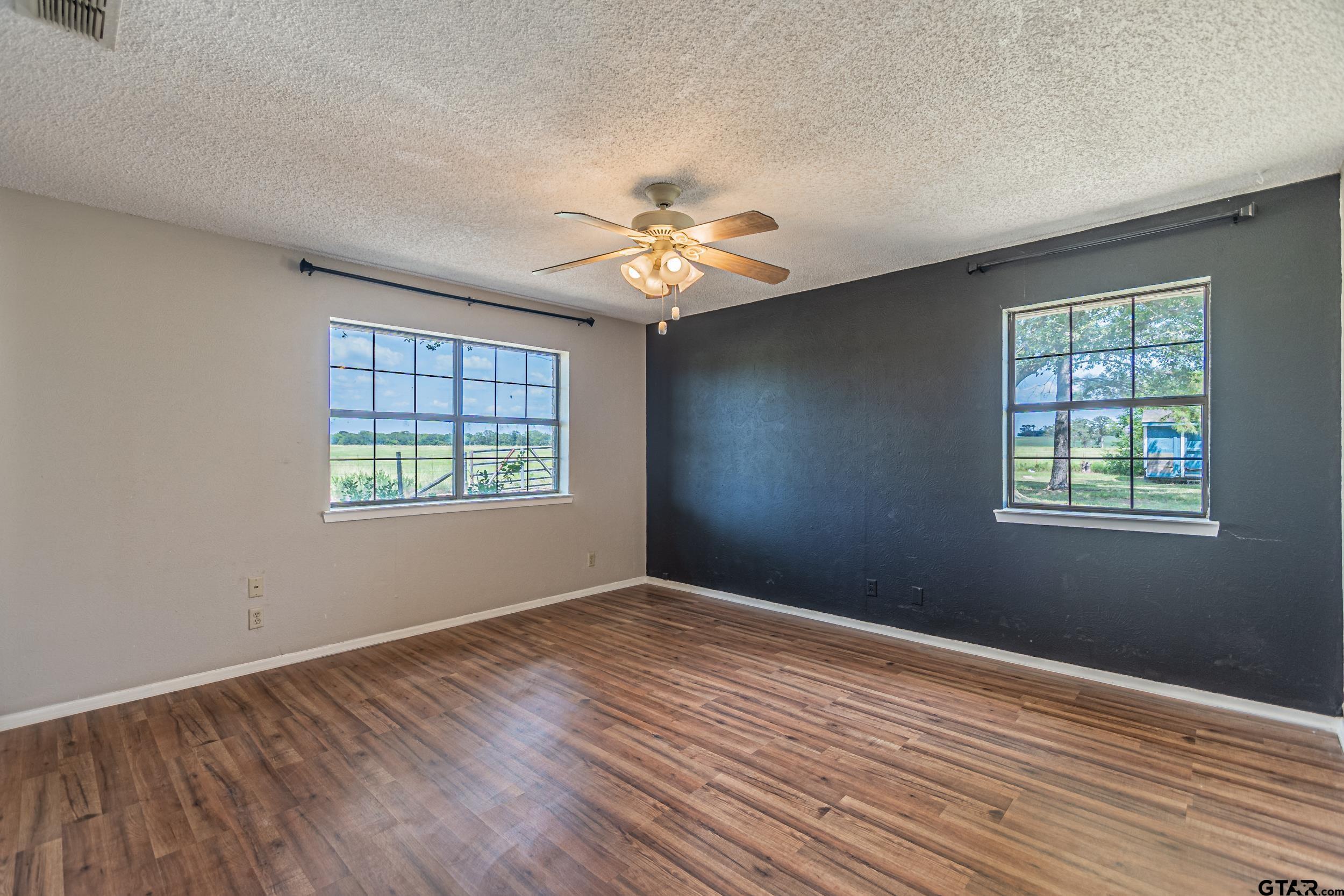 401 VZ County Road Canton, TX 75103 - Photo 34 of 45 wooden floor in an empty room with a window