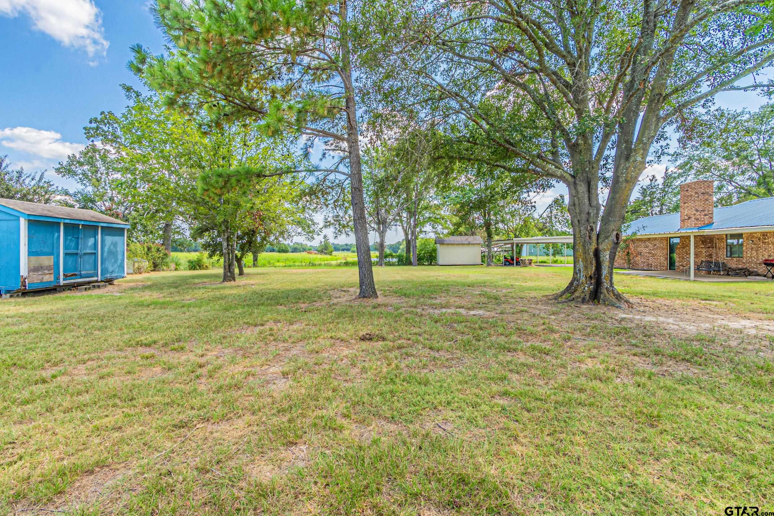 401 VZ County Road Canton, TX 75103 - Photo 42 of 45 a view of a house with a big yard and large trees
