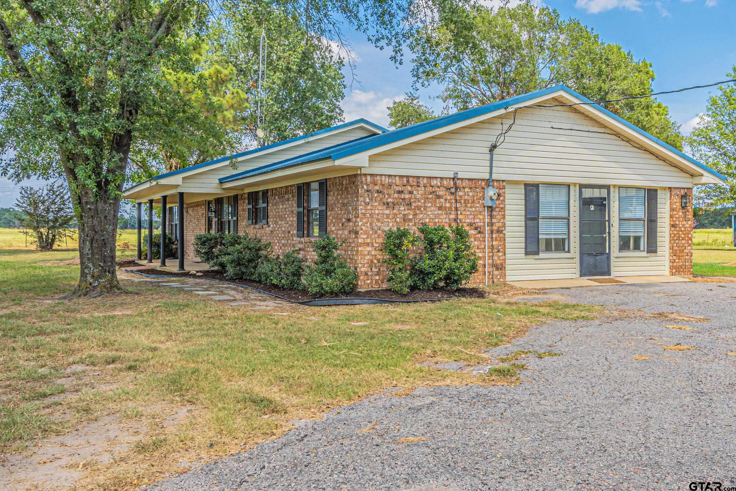 401 VZ County Road Canton, TX 75103 - Photo 7 of 45 a front view of a house with garden