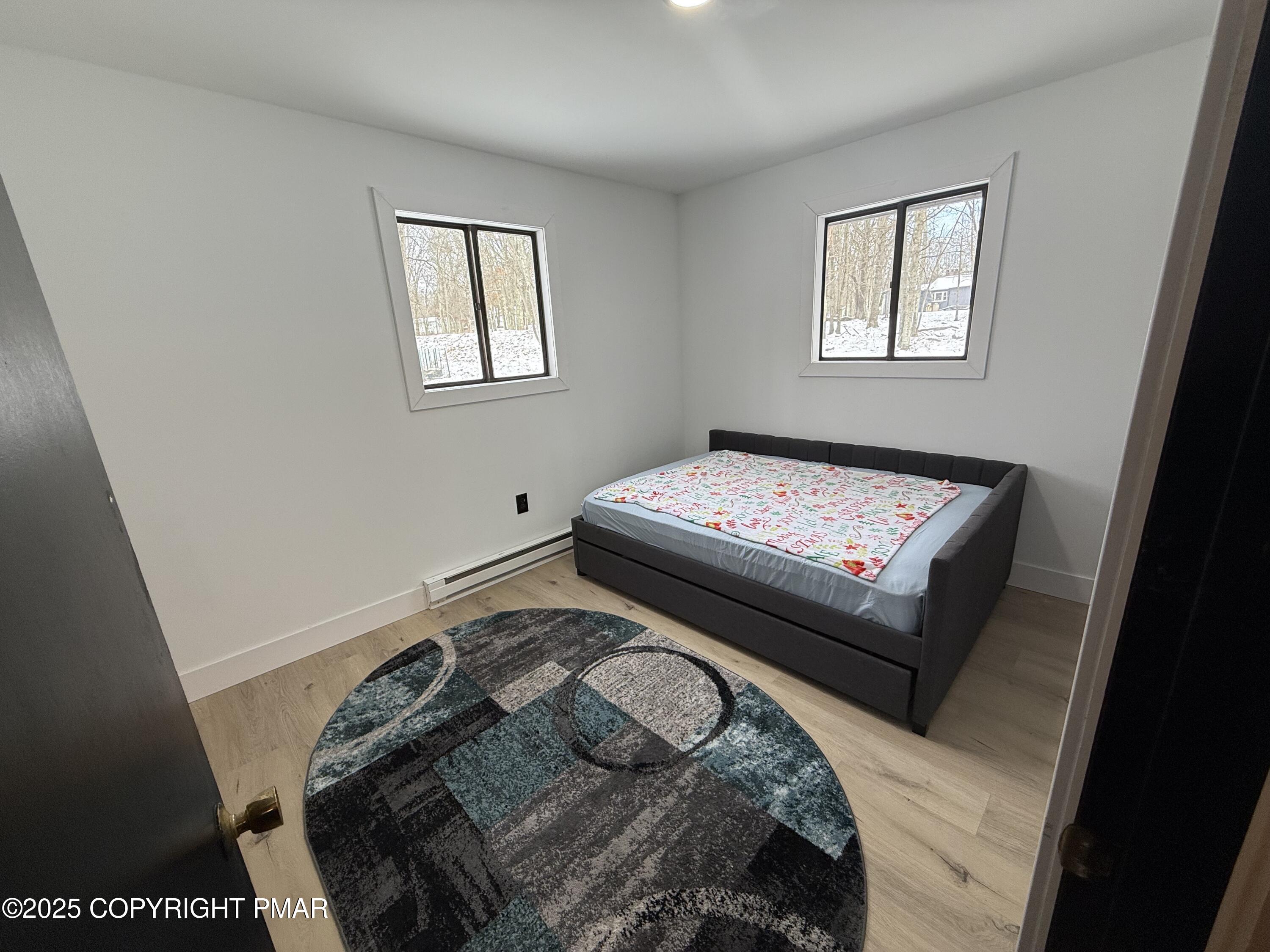 1215 Steele Circle Bushkill, PA 18324 - Photo 11 of 13 a bedroom with a bed and a window